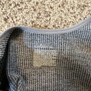 Grey body suit. Medium. Never worn.